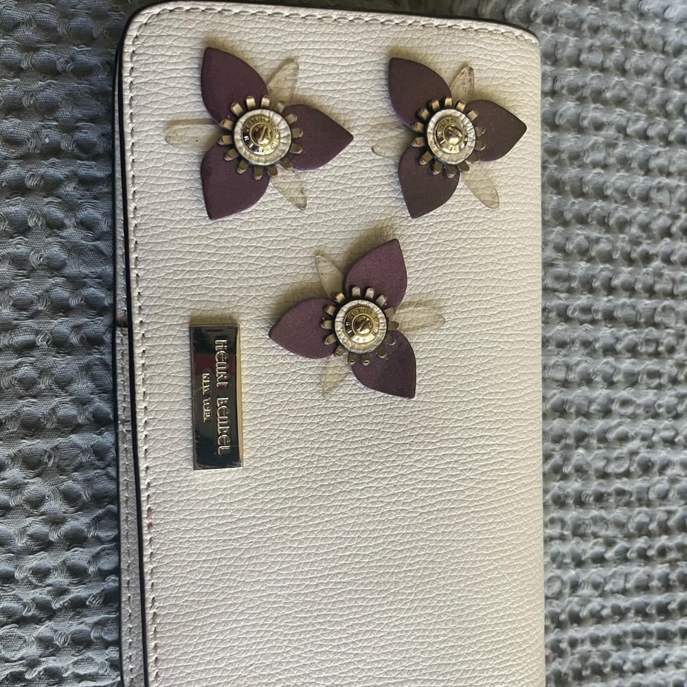 Henri Bendel Cream Phone Case Wallet with Purple Floral Design